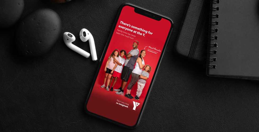 headphone and a phone with an ad for the YMCA on it