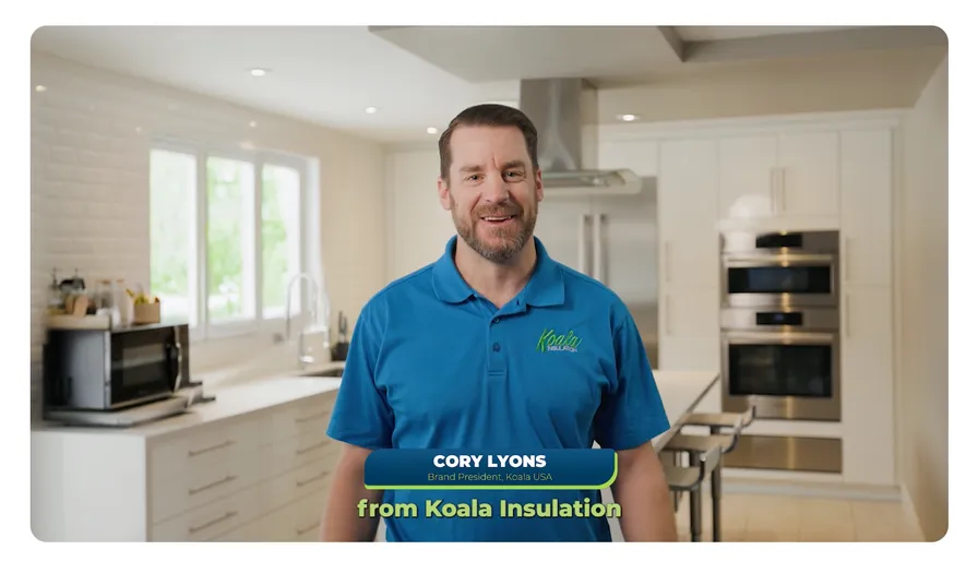 Cory Lyons, Brand President of Koala USA, in a kitchen wearing a blue Koala Insulation polo