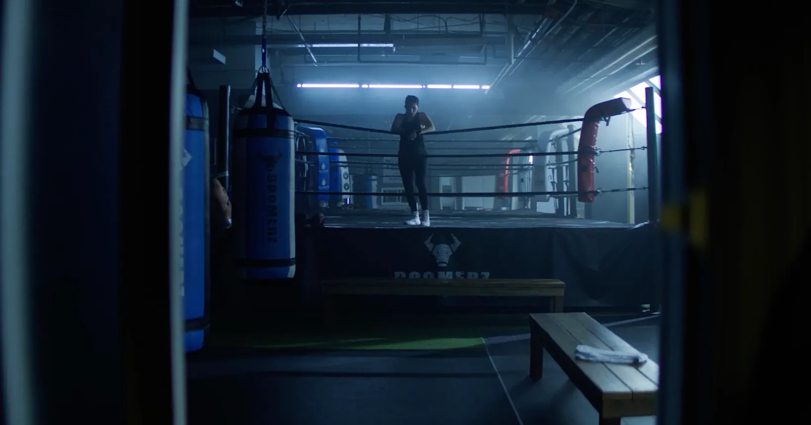 A boxer on the side of a boxing ring