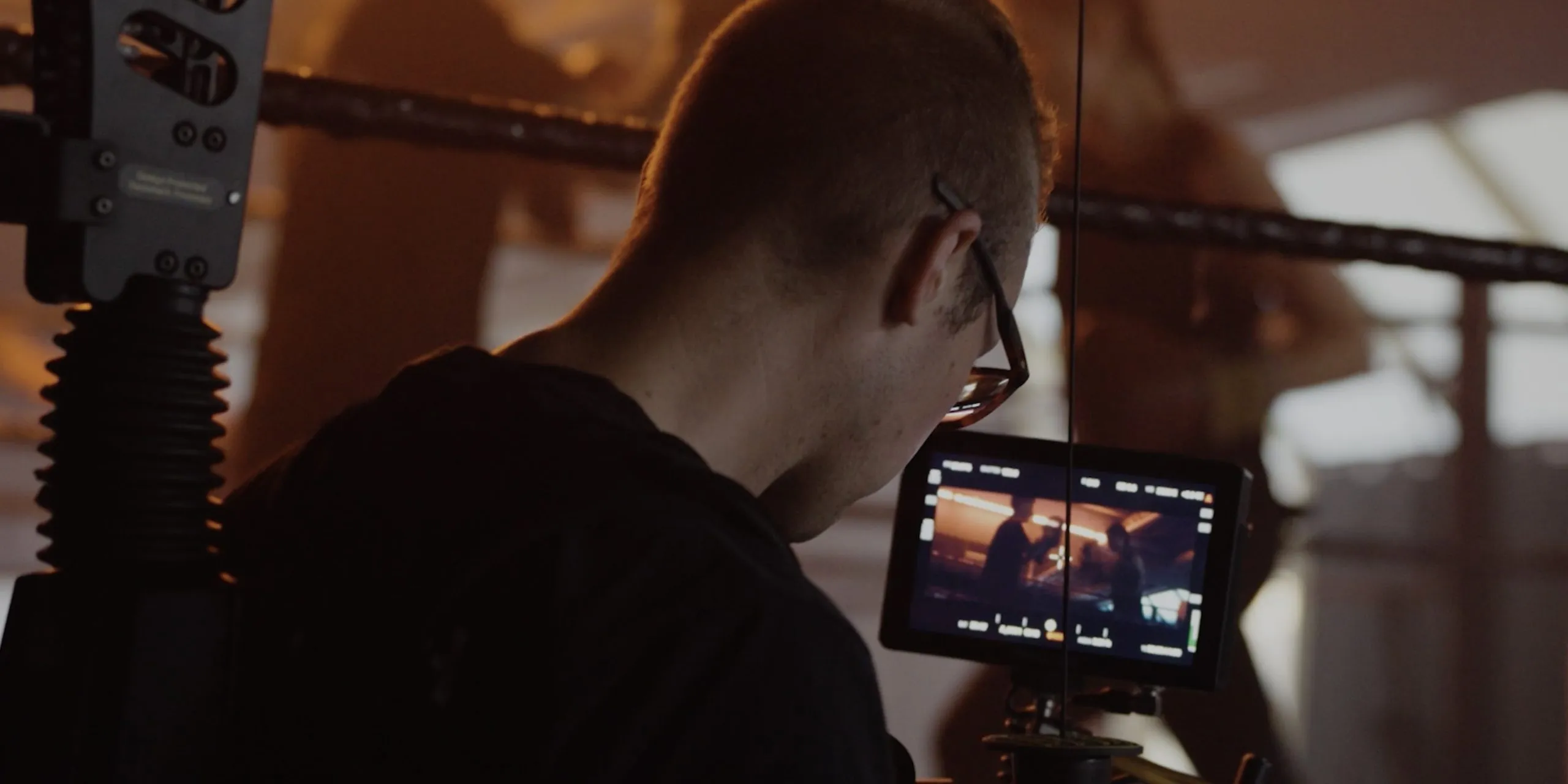 a man filming a video of 2 people boxing