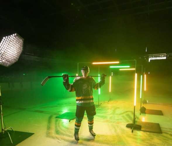 a hockey player on the ice at a photo shoot