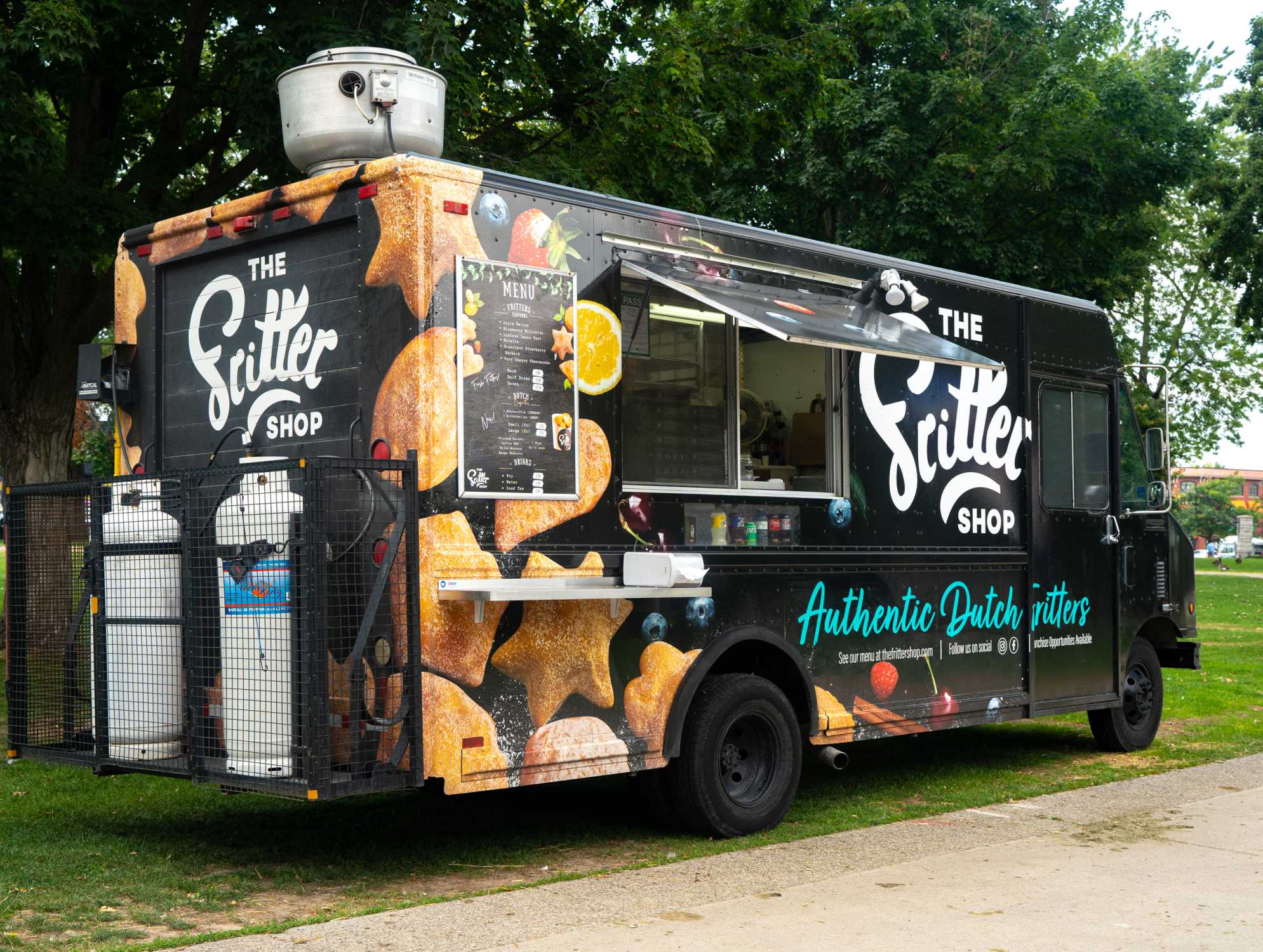 The Fritter Shop's food truck in a park