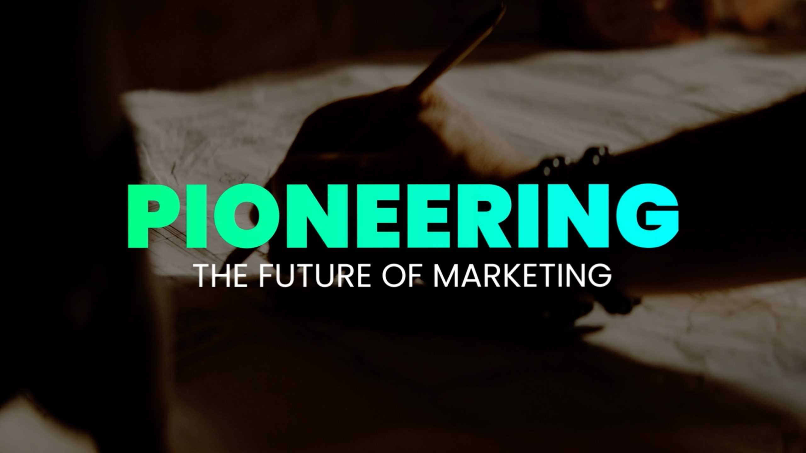 a hand writing with the text Pioneering the future of marketing
