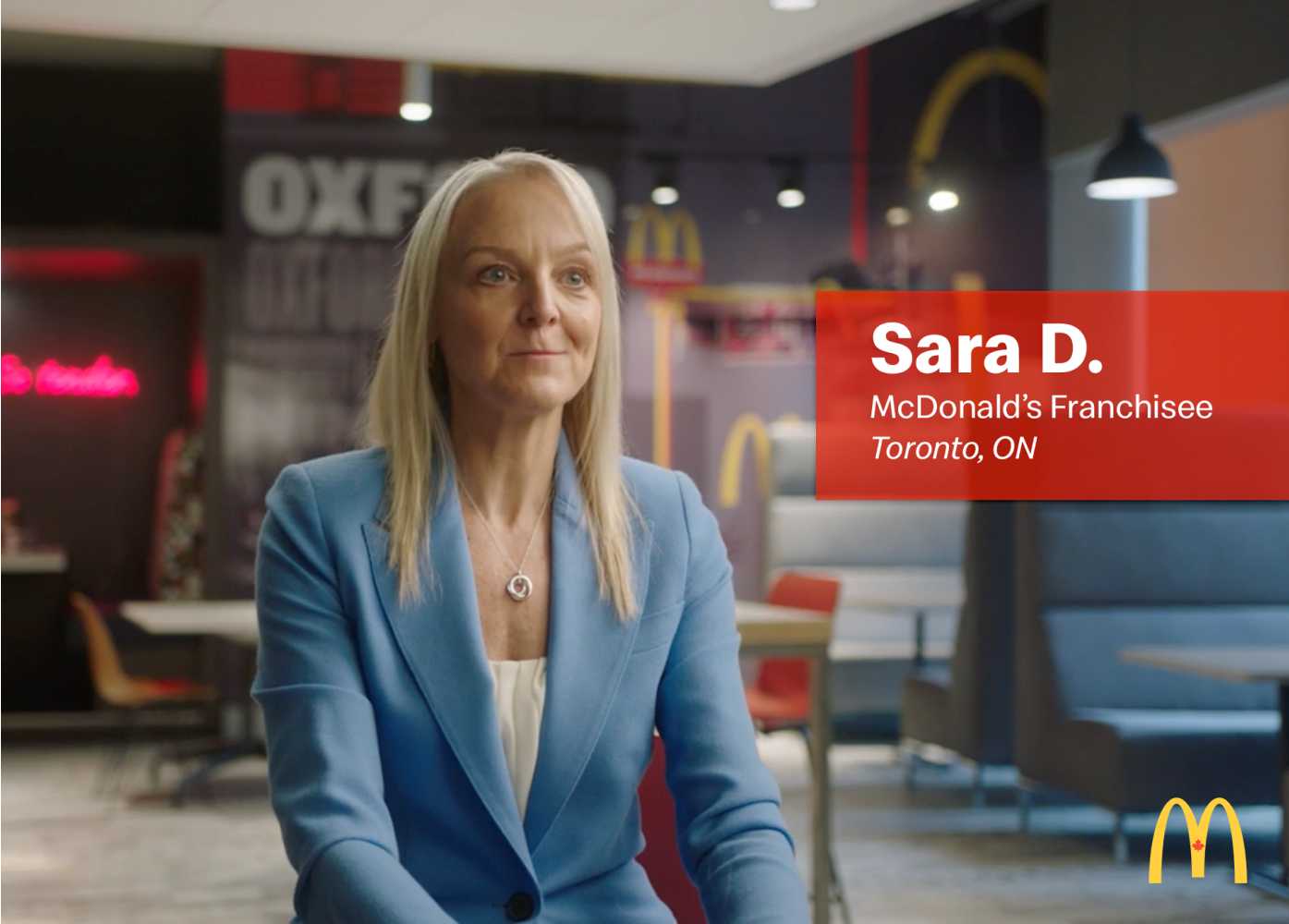 Sara D, a McDonalds Franchise owner sitting in the lobby of a McDonalds